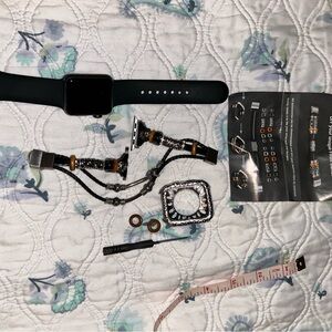 Apple Watch with black band and dressy beaded with silver hardware